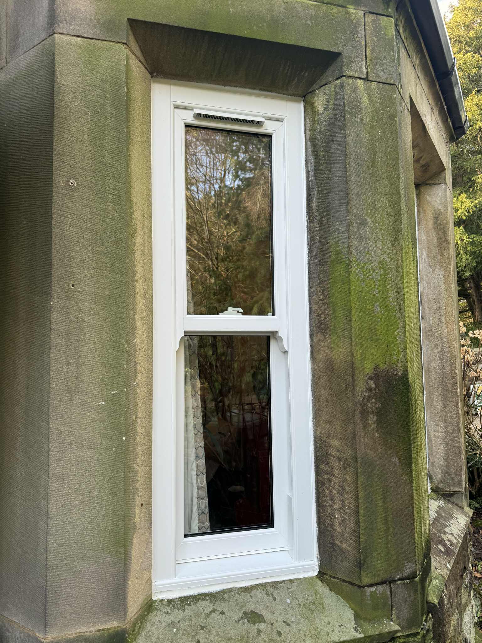 Slim midrail uPVC sash windows designed to match the traditional character of Stancliffe Hall