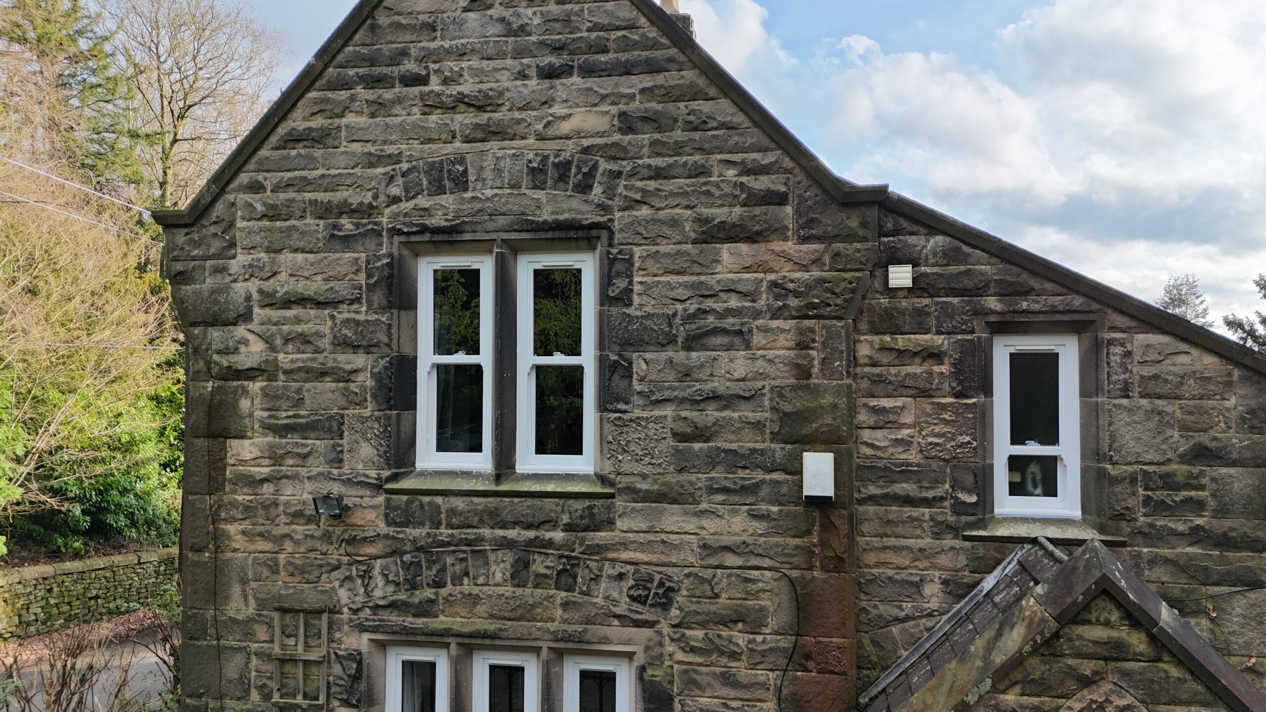 White uPVC sliding sash windows installed at Stancliffe Hall during a five-star renovation project