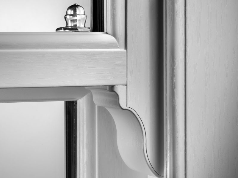 Close-up view of a window sash horn featuring seamless integration and mechanical joints.