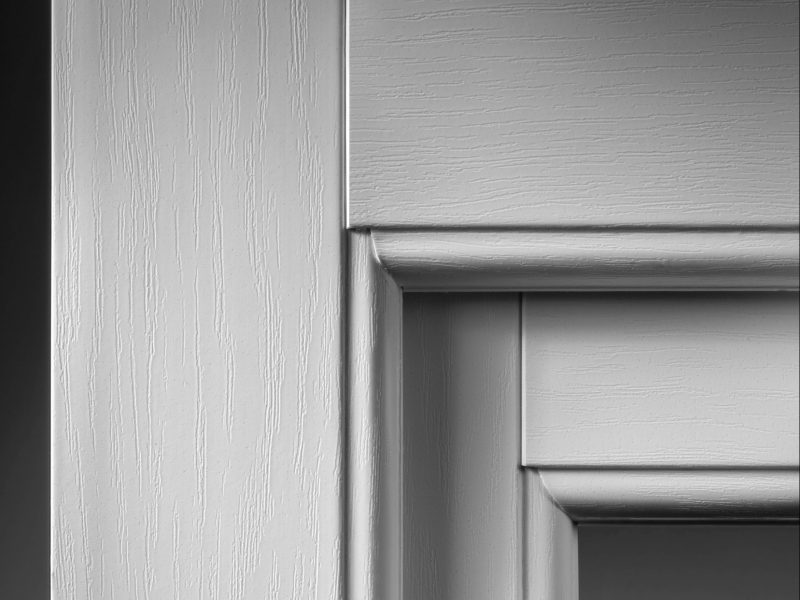 Close-up of standard mitre welds on uPVC window corners.